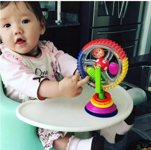 Baby Playing with a Colorful Suction Cup Spinning To