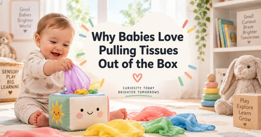 A happy baby playing with a colourful sensory tissue box toy, pulling fabric tissues from the box while exploring textures and movement during sensory play at home
