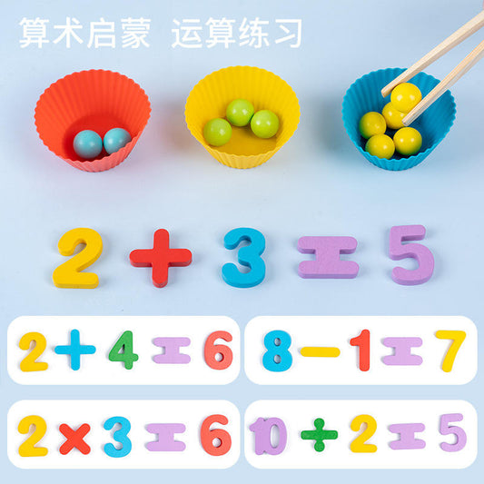 Educational toys with colorful numbers and bowls of marbles on a light blue background.