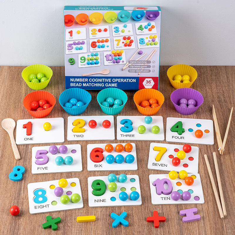 Educational number matching game with colorful components on a wooden surface