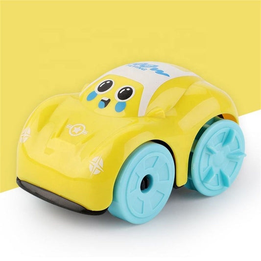 Yellow toy car with blue wheels on a white surface against a yellow background
